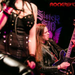 Jimmy wailing on the guitar with Liv's girls in the way